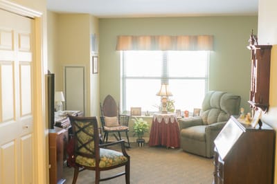 Cozy interior of a private resident room with seating