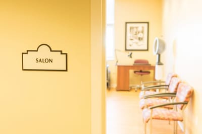 Salon sign in a warmly lit interior