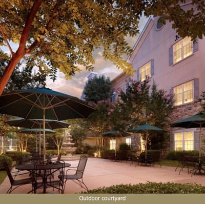 Outdoor courtyard with seating and trees