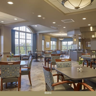 Bright dining area with tables and chairs
