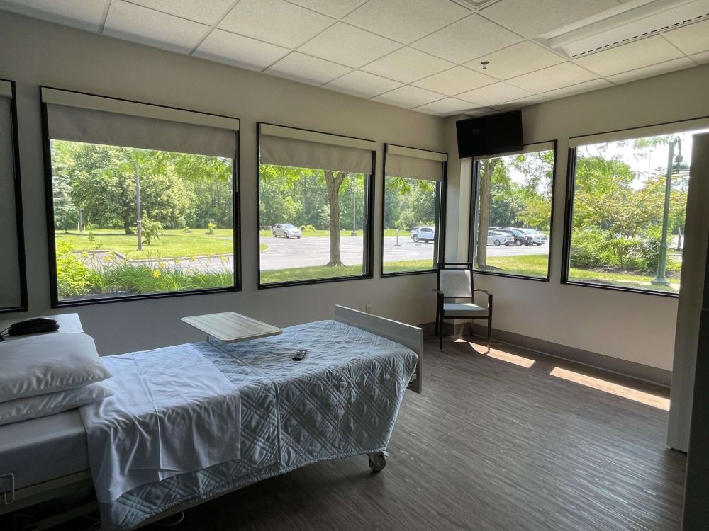 Bright interior of a resident room with large windows