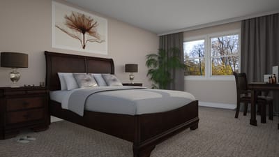 A well-furnished bedroom in a senior living facility