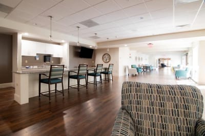 Bright common area with seating and kitchen island