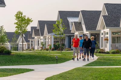 Residents walking along a winding path in the community
