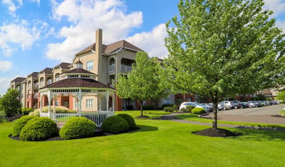 Well-maintained outdoor area with gazebo and building