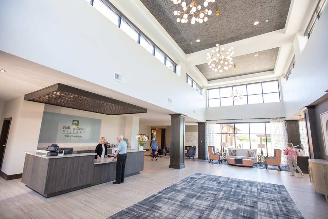 Bright and spacious lobby area with residents and staff