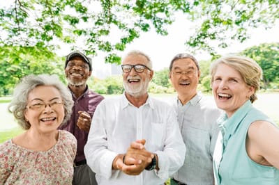 Group of smiling seniors enjoying time outdoors