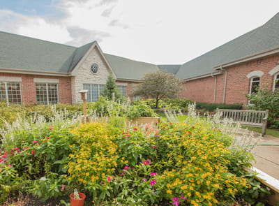 Vibrant flower garden outside a senior living facility