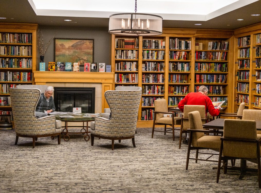Residents enjoying a cozy reading area in the library