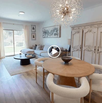 Bright common area with a dining table and a view