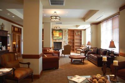Cozy common area with comfortable seating and artwork