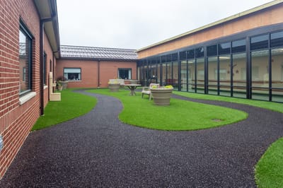 Pathway leading through a well-maintained outdoor garden area