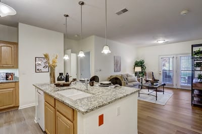 Bright interior view of a modern kitchen and living area