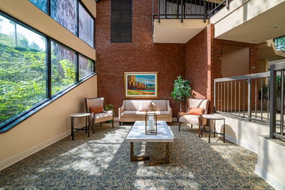Bright common area with seating and artwork