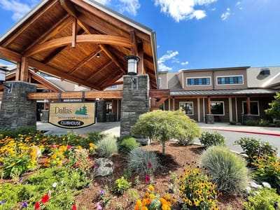 Main entrance of a retirement community with flowers