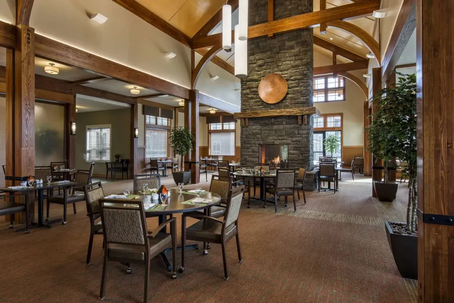 Dining area with tables and a fireplace