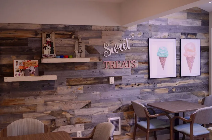 Cozy common area with decorative wall and seating
