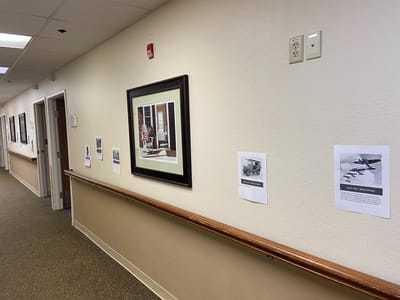 Hallway with framed pictures and information displays