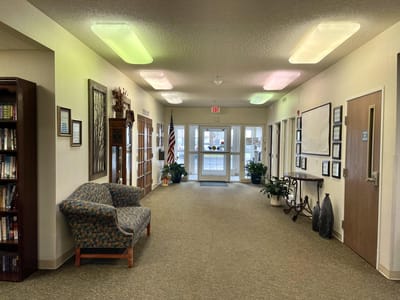 Interior hallway with seating and plants
