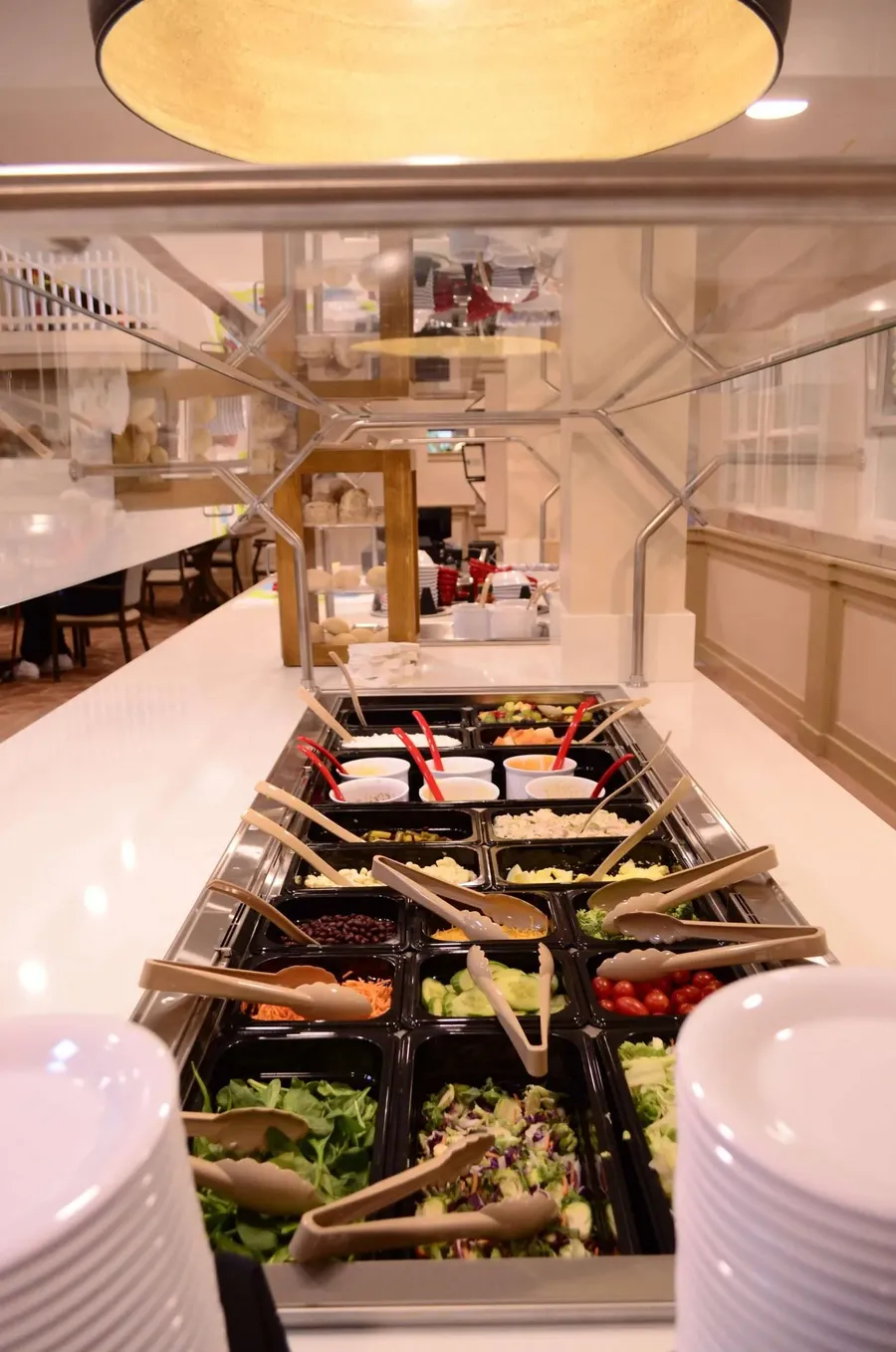 A vibrant salad bar with various toppings and ingredients