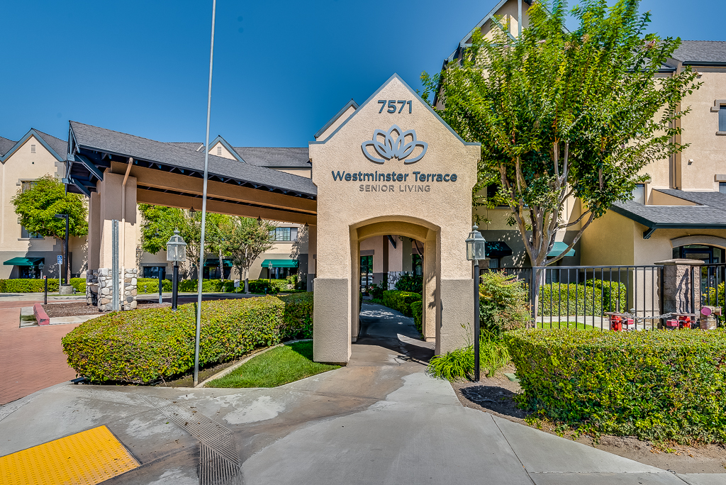 Entrance of Westminster Terrace Senior Living with landscaping