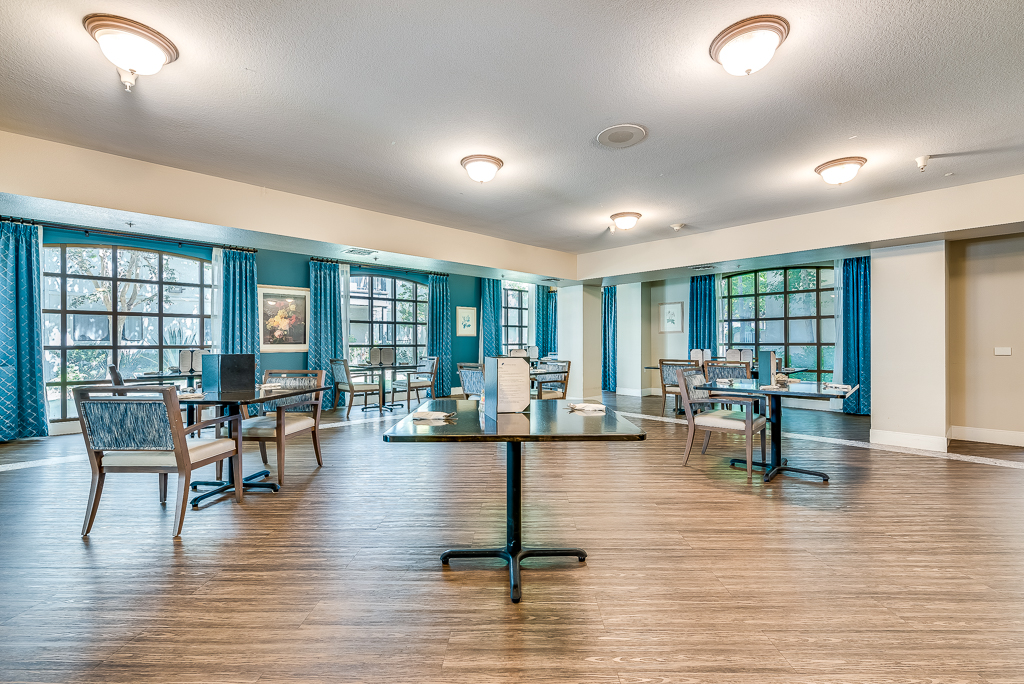 Bright dining area with tables and chairs