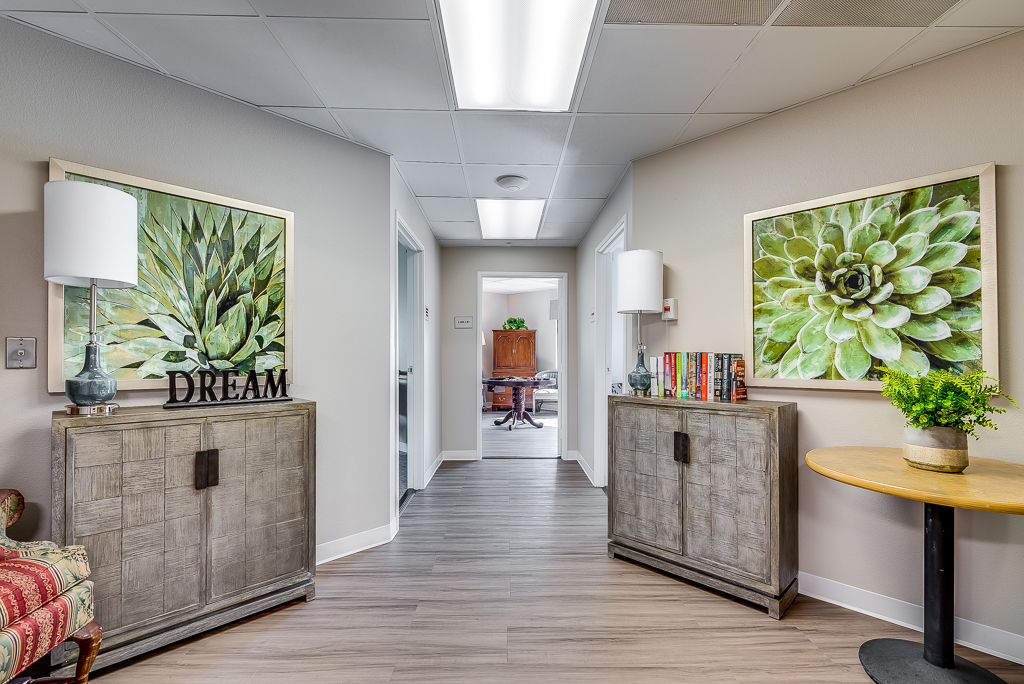 Interior hallway with decorative plants and furniture