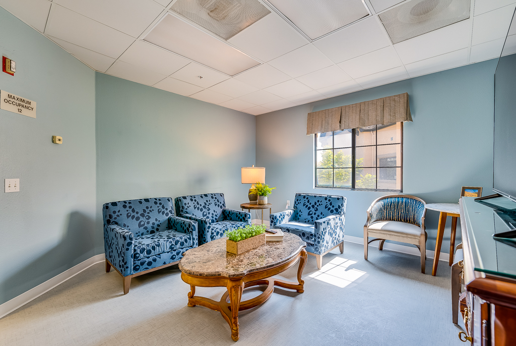 Bright common area with comfortable seating and natural light