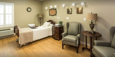 Well-furnished private resident room with warm lighting