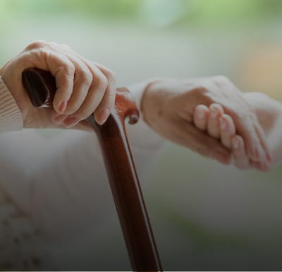 Close-up of hands clasped, showing connection between two people