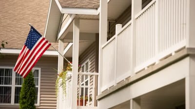 Exterior view of a facility with an American flag