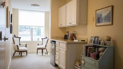 Cozy resident room with seating area and window