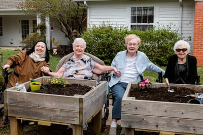 Residents gardening together in an outdoor space