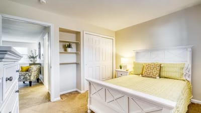 Bright private resident room with a cozy bed