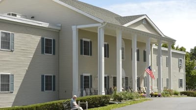 Exterior view of a senior living facility with porch