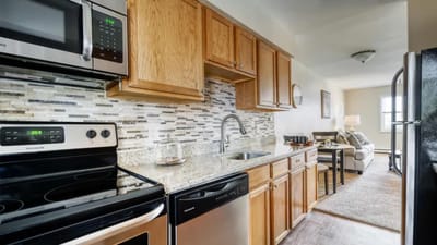 Modern kitchen interior with appliances and seating area