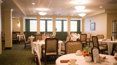 Bright dining room with tables set for meals