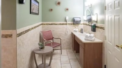 Interior view of a bathroom area with a chair