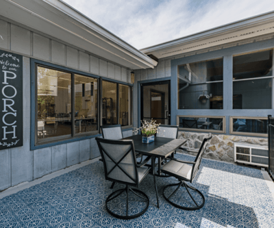 Outdoor porch with seating and decorative tiles