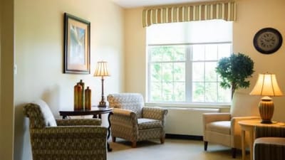 Cozy common area with comfortable seating and lamps