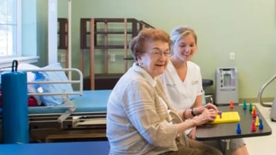 Resident and staff engaging in a recreational activity