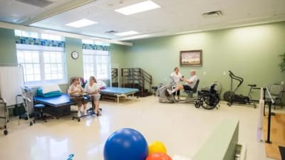 Residents participating in a physical therapy session