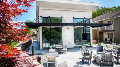 Outdoor seating area with modern architecture and landscaping