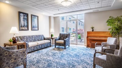 Bright common area with seating and natural light