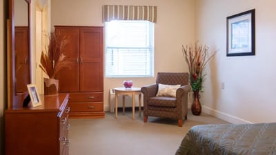 Cozy interior of a resident's bedroom with furniture