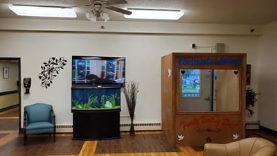 Interior common area with fish tank and signage