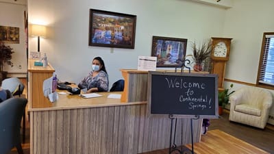 Reception area with staff member at desk