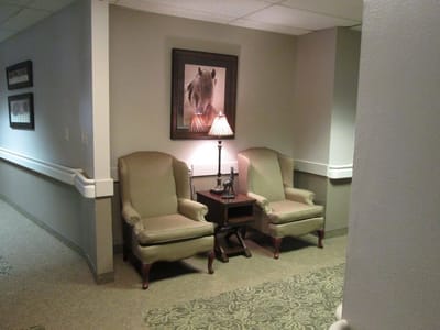 Cozy seating area in a facility hallway