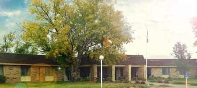 Exterior view of Garden Valley Retirement Village with trees