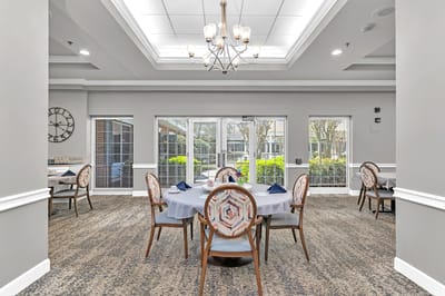Dining area with tables set for residents